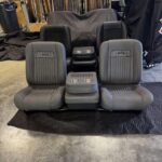 Bucket seats with flip down console